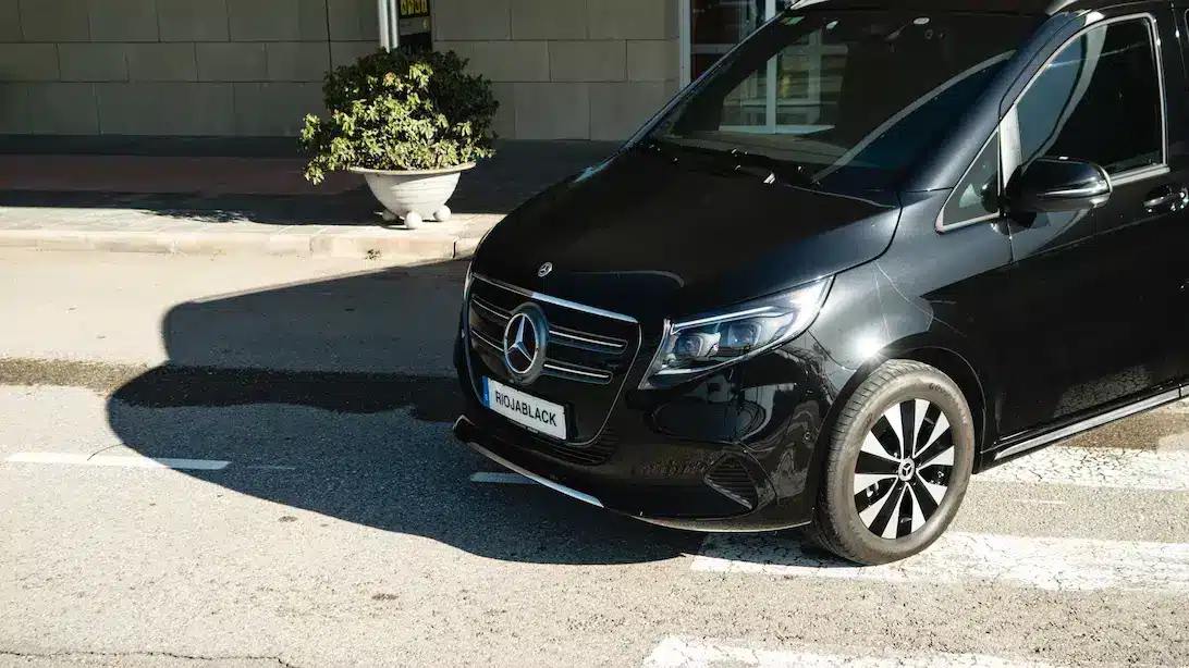 Front view of a luxury black Mercedes V-Class waiting for clients at Logrono-Agoncillo airport for premium private transfers in La Rioja.